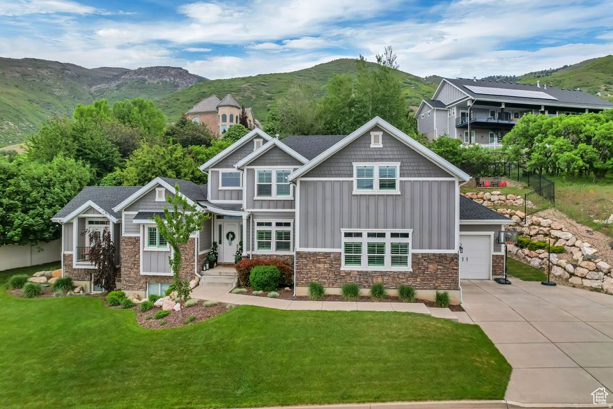 This beautiful 8 bed 6 bath home on the foothills of the Wasatch Mountains, overlooking the Great Salt Lake. With vaulted & coffered ceilings, large kitchen island, Grand Primary Suite on main level with office attached through a hidden Murphy door. Mother-In-Law apt downstairs has a full kitchen. Enjoy gorgeous sunsets from the Bedroom Balcony and the Back Patio is a perfect spot to enjoy summer evenings with family and friends.