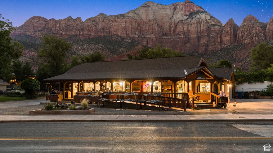 This is the rare opportunity to build your life and your business in Zion National Park. This profitable, well established Rock Shop (it has been a rock and gem shop for over 20 years) offers prime frontage, high visibility, and the freedom to live where you work in the vibrant town of Springdale, Utah. The property includes approximately 1,719 square feet of commercial space with good strong financials. Attached is a 1,646 square foot 3 bedroom 2 bath private apartment, ideal as an owner's residence, staff housing, or an additional rental unit. There's also a 60 square foot basement for storage, and the property sits on a 0.30-acre lot with on-site parking, this setup is flexible and functional. The location sees millions of visitors passing by each year. Whether you want to continue the rock shop tradition or launch your own concept, the infrastructure is in place. The current manager welcomes the continuation of managing the business as it stands. This can help ensure stability of an ongoing business and offers the potential to develop a strong social media presence as well. Wake up every day to towering red cliffs, glowing skies, and a built-in audience just outside your door. If you've been waiting for a sign to step into a new chapter, where your business is fueled by the energy of Zion and your backyard feels like a national treasure, this is it.