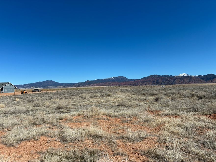 20+ acres with stunning views. Drilled well with one acre-foot 1916 water right included. Additional acre-foot available separately. Power nearby. Plenty of space to build and enjoy rural living. Animal rights. Buyer to verify all information.
