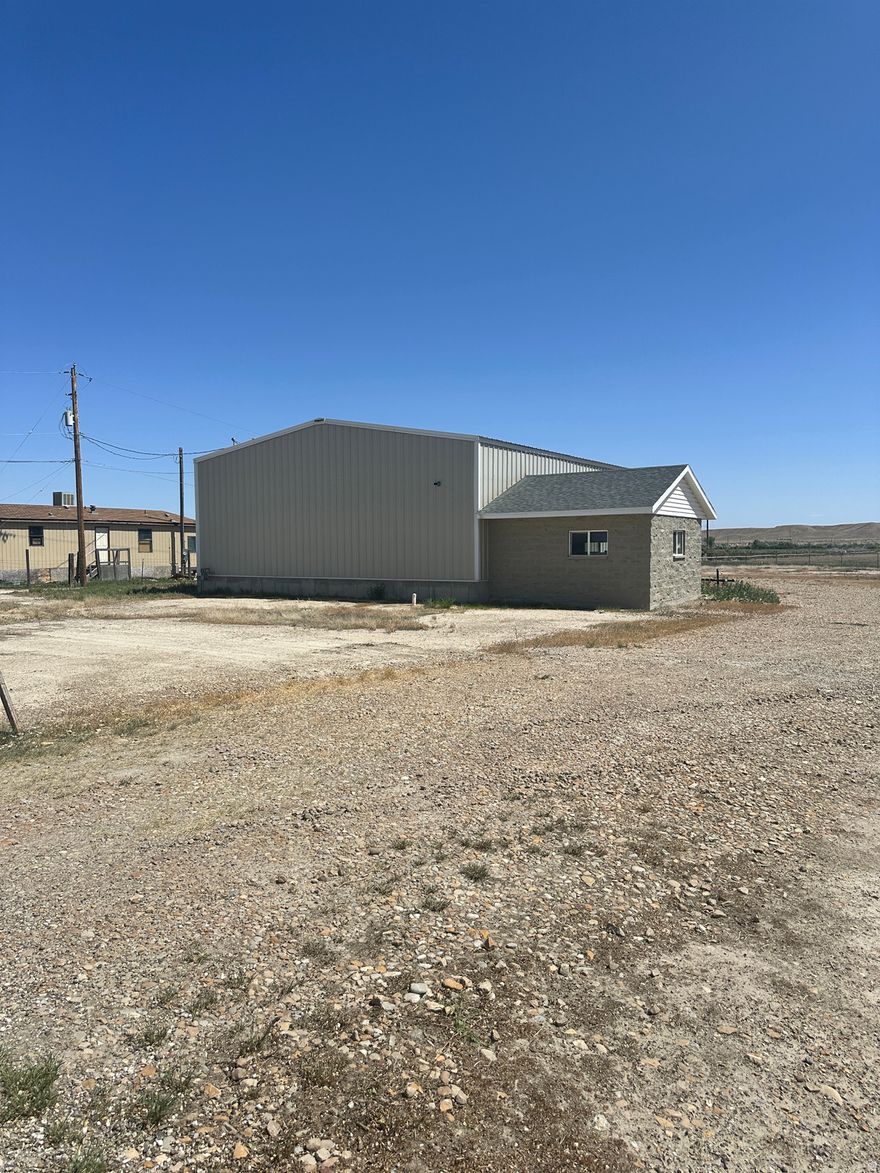 Looking to grow your business? This commercial property offers the perfect solution. Situated on 1.73 fully fenced acres, this property provides ample room for growth. Building has a 16 x 16 office and a bathroom with shower in the 60 x 40 metal building. Square footage figures are provided as a courtesy estimate only and were obtained from County Records . Buyer is advised to obtain an independent measurement.