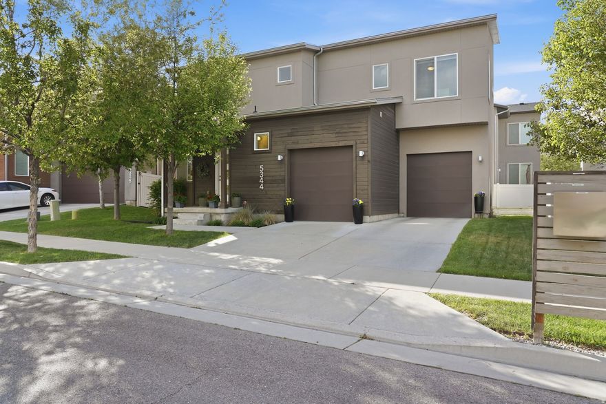 Turn-key 3-bed, 2-full + 2-half bath in Herriman Towne Center. 2,349 sqft, built 2015. Open main-floor plan, solid surface counters, primary walk-in closet, 2-car garage. Energy Star with solar means low power bills. HOA just $144/year covers park and common areas. Finished basement works as art studio, family room, playroom, or office. Peaceful patio, small intentional yard. Walk to J. Lynn Crane Park's summer concerts and food trucks. Ideal for young families or first-time buyers.