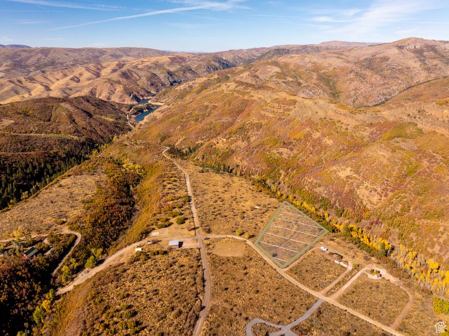 Set your sights on the cool green hills of Causey Estates. Minutes from Causey Reservoir, this 2.65-acre mountain recreation parcel sits in a private, gated community surrounded by scrub oak, sage, and wildlife plus unobstructed mountain views. A circular driveway has been cut in, and work has started on a road to a potential campsite. The lot is connected to community water, and Rocky Mountain Power is ready to hook up. A seasonal creek runs behind the property and is fun to explore when flowing, adding a playful natural backdrop.  With a gentle grade, the property offers flexible options to create your own exclusive campground now or plan for a future mountain cabin. Community amenities archery, basketball, volleyball courts, and creekside picnic areas add to the appeal of the area. Enjoy a quiet hideaway near Huntsville with endless four-season fun: fishing, hiking, swimming, canoeing, kayaking, 4-wheeling, snowmobiling, snow-shoeing, and cross-country skiing. Tracked vehicles required in winter months. Make this retreat a multi-generational tradition for years to come. *All property information, boundaries and documents to be verified by buyer.