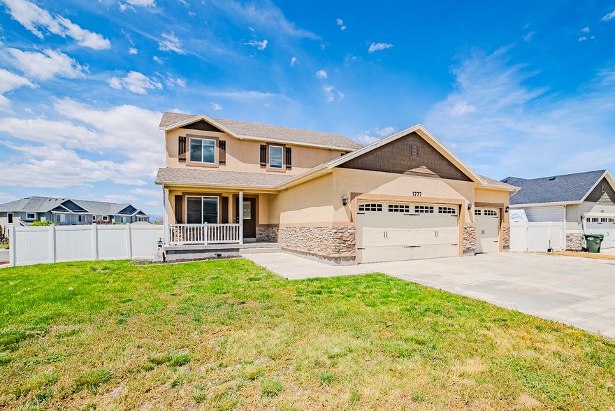 Beautifully updated 2-story home on a desirable corner lot in Tooele, offering generous space, thoughtful upgrades, and a fully finished basement. The bright, functional layout features a spacious kitchen with granite countertops, rich cabinets, center island and seamless flow into the dining and living areas, complete with a gas log fireplace. The primary suite offers a relaxing retreat with a soaking jetted tub, separate shower, and mountain views, while the basement adds exceptional versatility with a large family room, 2 bedrooms and additional bath. Enjoy the fully fenced yard, patio for outdoor gatherings, oversized 3-car garage, and welcoming front porch. Conveniently located just off Main Street near shopping, dining, and entertainment, several parks, less than 10 minutes to Oquirrh Hills Golf Course, 15 minutes to The Peak Sports & Entertainment Complex, and approximately 35 minutes to Salt Lake International Airport. This home is a must see!  Buyer is advised to independently verify all measurements and property information to their satisfaction.