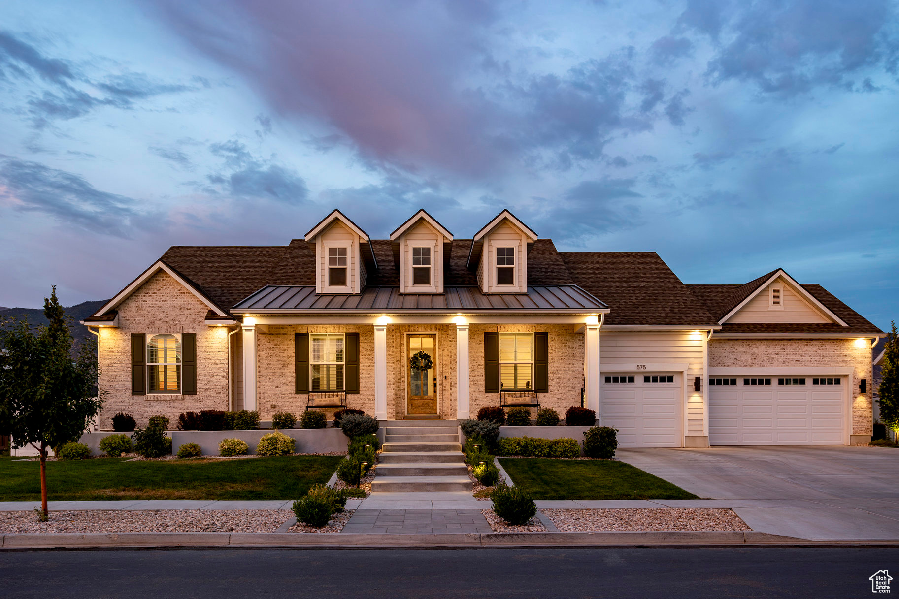 Looking for peace, privacy, and breathtaking mountain views while staying close to everything you love? You've found the one! Built in 2021, this beautifully designed home offers a peaceful setting on a .30 acre fully-fenced lot with no backyard neighbors, and still feels brand new! From the white brick exterior and welcoming front porch to the light-filled open floor plan, every detail feels intentional and inviting. Off the entry, a dedicated home office features custom built-ins with thoughtful touches like filing cabinet drawers and a hidden pullout keyboard, plus a warm wood herringbone accent wall. Natural light pours into the living room from huge windows that perfectly frame the mountain views. The kitchen boasts upscale appliances including a Wolf induction cooktop, Bausch dishwasher, GE Caf refrigerator, double ovens, plus an oversized island with seating for five and a large walk-in pantry with a convenient "Costco door" making it easy to get your groceries in from the garage. Enjoy smart-home touches galore, including electric shades, WiFi-enabled appliances, a smart lock on the front door, network data outlets in all bedrooms, and pre-wiring for security cameras and Christmas light outlets in the eaves. On the main level, you'll find three large bedrooms, including the luxurious primary suite with a spa-like ensuite bath and walk-in closet. There is also a dedicated laundry room with storage, a sink, and plenty of counter space. The fully finished basement offers even more space with a huge family room, three additional bedrooms, a full bathroom, and a home gym. Outside, the backyard is a true retreat with a covered patio, built-in gas fireplace, hot tub, fire pit with seating, a large grassy area, peach trees, and plenty of room to play or entertain. As if the home weren't enough to win you over, the location couldn't be better! Living in this neighborhood puts you just seven minutes from the shopping, dining, and entertainment at Farmington Station, 25 minutes from Salt Lake City, and close to outdoor recreation with trails, parks, two golf courses, and an equestrian center within 10 minutes. This home truly offers the seamless lifestyle you've been dreaming of!