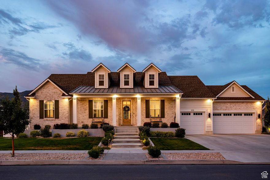 Looking for peace, privacy, and breathtaking mountain views while staying close to everything you love? You've found the one! Built in 2021, this beautifully designed home offers a peaceful setting on a .30 acre fully-fenced lot with no backyard neighbors, and still feels brand new! From the white brick exterior and welcoming front porch to the light-filled open floor plan, every detail feels intentional and inviting. Off the entry, a dedicated home office features custom built-ins with thoughtful touches like filing cabinet drawers and a hidden pullout keyboard, plus a warm wood herringbone accent wall. Natural light pours into the living room from huge windows that perfectly frame the mountain views. The kitchen boasts upscale appliances including a Wolf induction cooktop, Bausch dishwasher, GE Caf refrigerator, double ovens, plus an oversized island with seating for five and a large walk-in pantry with a convenient "Costco door" making it easy to get your groceries in from the garage. Enjoy smart-home touches galore, including electric shades, WiFi-enabled appliances, a smart lock on the front door, network data outlets in all bedrooms, and pre-wiring for security cameras and Christmas light outlets in the eaves. On the main level, you'll find three large bedrooms, including the luxurious primary suite with a spa-like ensuite bath and walk-in closet. There is also a dedicated laundry room with storage, a sink, and plenty of counter space. The fully finished basement offers even more space with a huge family room, three additional bedrooms, a full bathroom, and a home gym. Outside, the backyard is a true retreat with a covered patio, built-in gas fireplace, hot tub, fire pit with seating, a large grassy area, peach trees, and plenty of room to play or entertain. As if the home weren't enough to win you over, the location couldn't be better! Living in this neighborhood puts you just seven minutes from the shopping, dining, and entertainment at Farmington Station, 25 minutes from Salt Lake City, and close to outdoor recreation with trails, parks, two golf courses, and an equestrian center within 10 minutes. This home truly offers the seamless lifestyle you've been dreaming of!