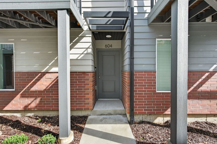 Please join us for an Open House Saturday 3/14/26 11:00-1:30! Nestled in the sought-after Dawson Place community, this stunning townhome perfectly balances sleek design with an outdoor lover's dream location. Step inside to a bright, open-concept living space elevated by 9-foot ceilings and beautiful, durable flooring. The heart of the home is a stylish kitchen designed to impress, featuring extended-height cabinetry, gleaming granite countertops, and a seamless flow to your private, low-maintenance composite deck. Built by a multi-award-winning builder, this home is as smart as it is beautiful. Enjoy the everyday convenience of an attached two-car tandem garage and breathe easy with a state-of-the-art, all-electric energy system designed for ultimate comfort and a lower carbon footprint. The lifestyle here is truly unmatched. You are just minutes from Downtown Salt Lake City, the airport, and Trax lines, while the 9-Line trail, Jordan River trail, and seven world-class canyons are right in your backyard.