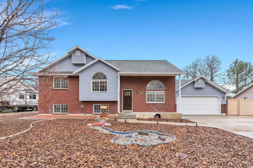 Enjoy stunning mountain views from this charming split-level home nestled in the heart of Springville. Thoughtfully designed with tall ceilings and abundant natural light, the main living area offers a welcoming and open feel. The kitchen features granite countertops, a built-in dishwasher, ample cabinetry, and a center island with additional seating, ideal for everyday use and entertaining. Upstairs, the spacious primary bedroom is filled with natural light and includes an ensuite bathroom. The basement provides a versatile second living area, two additional bedrooms, a full bathroom, and generous storage space throughout. The seller is offering a $500 credit toward replacement of the basement toilet. Outside, the property offers RV parking and a large xeriscaped backyard, minimizing maintenance while maximizing usability. Conveniently located near local parks, the Canyon, and less than a 10 minute drive from the I-15, this home combines comfort, functionality, and a prime Utah County location. Measurements provided as a courtesy only, buyer to verify all info.