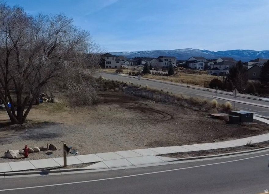 Rare opportunity to own a stunning .34 acre flat building lot in the heart of the Heber Valley.  This ready to build parcel offers breathtaking, unobstructed views of Mount Timpanogos and sweeping panoramas of the entire Heber Valley.  The level of topography makes building simple and cost effective with utilities stubbed and ready to go--this gives you the perfect canvas to design your dream home.  Building lots with views like this and an easy build are hard to find in this area.  Don't miss this exceptional opportunity. Owner agent. Buyer to verify all information.  Square footage figures are provided as a courtesy estimate only.  Buyer is advised to obtain an independent measurement.