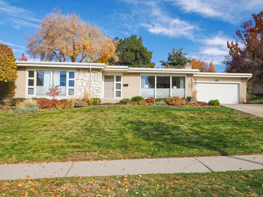Discover this stunning rambler nestled in one of Salt Lake City's most desirable neighborhoods.  Beautifully perched in the high Avenues, this light-filled home offers the perfect blend of charm, comfort and location.  Large windows welcome in sweeping natural light throughout the day, highlighting warm living spaces and capture some city and mountain views.  The layout is open and inviting with thoughtful updates that complement the home's classic character.  Impeccably maintained and exceptionally clean, this home shines from the moment you walk in.  Every space feels cared for and thoughtfully kept.  The pride of ownership is evident in every detail -- this is a home that has truly been loved.  This is a rare find in the Avenues:  spotless, beautifully maintained, and move-in ready.  This gorgeous home offers 6 bedrooms and 3 bathrooms providing flexibility for families, guests, offices or hobbies.  The basement features brand-new carpet installed in 2024, adding warmth and a fresh finish to the lower level.  Outside, the property sits on a generous .28-acre lot, an incredible find in the Avenues. The gorgeous,  private backyard feels like it's own retreat, complete with a covered patio perfect for outdoor dining and relaxing.  The mature landscaping is breathtaking!  This home is a true Avenues gem with room for everyone.