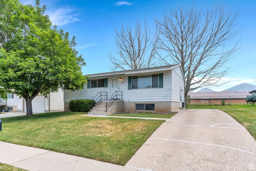 Very clean spacious home in an established neighborhood backing the school yard. Nice views of the mountain. Easy access to freeway and commercial. Full spacious basement ready to be finished into living space or ADU. Large yard and room for a garage/shop. The large trees in the backyard have been removed. All figures per county records. Buyer to verify.