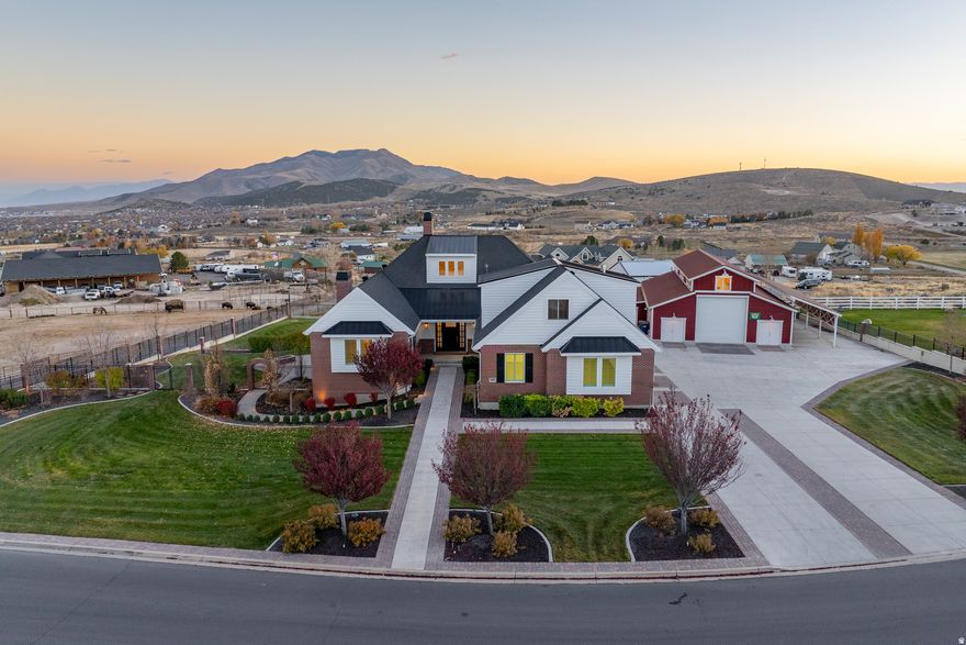 An estate that boldly separates itself from the pack with timeless architecture on a flawlessly manicured .96-acre property. Mountain and valley views from the deck are so good you can't help but take a moment to appreciate them. You'll love the superior craftsmanship throughout the home-hardwood floors, solid-core 8-foot doors, and custom cabinetry-paired with high-end upgrades like 50-year presidential shingles, a Control4 interior and exterior speaker system, and a dedicated TruGolf simulator room. The massive 2,400 SF shop/barn is a showpiece in its own right. Beyond its inherent beauty, the shop is heated, includes its own bathroom, and is structurally engineered for a future loft. Whether you need space for your boat, exotic car collection, or horses (the property is zoned for them), this structure offers unmatched versatility. The attached 3-car garage also features a spacious apartment loft with its own separate entrance. Picture summer evenings with friends and loved ones grilling on the deck while a game of wiffle ball plays out on the backyard's mini baseball field. Call or text the listing agent anytime for more information and to schedule a private tour of this incredible estate!