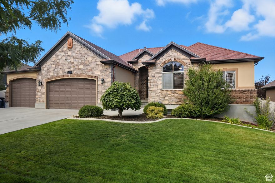 Come be absolutely delighted by this beautifully upgraded rambler that truly stands out! Every detail has been thoughtfully enhanced by a master electrician-from dimmer switches and designer light fixtures to custom cubby reading lights, outdoor motion-sensor lighting, cameras, and GoVee seasonal exterior lighting. The home offers income potential with a fully finished basement featuring its own separate entrance and laundry hookups-ideal for a basement apartment, guest suite, or extended family living. The Primary Bedroom suite is a dream, boasting a closet so large it feels like another bedroom-complete with a built-in vanity! Throughout the main level you'll find vaulted ceilings, granite countertops, plantation shutters, and large walk-in closets in every bedroom. Upgrades abound with a tankless water heater, large dual pantries upstairs and down, Trex deck, brand-new Bullfrog hot tub/spa, spacious & easy-access attic storage above the garage, extra can lighting, and beautifully updated bathrooms. The home theater room includes a professionally calibrated 7.1 surround sound system for the ultimate entertainment experience. Pride of ownership shines-freshly painted interiors, updated modern-style doors, and well-maintained systems throughout. The oversized 5-car garage offers extended length and height for large trucks, plus a large RV pad for all your toys. Enjoy your private backyard oasis with a huge deck and covered patio below-plenty of space for your hot tub, patio furniture, and gatherings. The surrounding neighborhood adds to the appeal, with scenic nature trails and close proximity to Ron Wood Community Park-home to baseball fields, open parks, playgrounds, a splash pad, pickleball and tennis courts, and a skate park. The district also has exciting plans to further develop and expand the park in the near future.