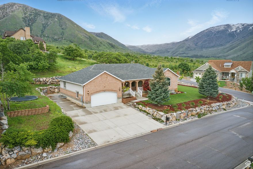 AGENTS- call me to discuss the Time Clause situation! Great opportunity to swoop! Located high atop postcard-perfect Elk Ridge, you will find this spacious custom home, featuring sweeping views of both the mountains and valley, and a quality place to gather and live. Two large family rooms greet you as you enter the front door, as well as a kitchen and dining area with plenty of elbow room for family and friends. The main level master bedroom as well as a secondary bedroom are accommodating and spacious. Downstairs you will love the 10 foot tall ceilings and second kitchen area, large family room, Bonus room ready to turn into a theater room or whatever your needs may be and three additional bedrooms with a second laundry area. Central Vacuum system is also featured for added convenience! Updated, light and bright, this home is sure to please! 3D Tour attached.