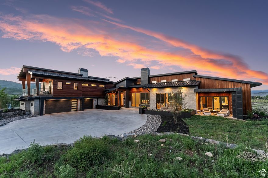 Welcome to this stunning newly constructed home located within the gates of the prestigious Glenwild Golf Club in Park City, Utah. This 6 bedroom residence boasts an abundance of natural light. With its expansive windows and spacious open floor plan that seamlessly extend outdoors onto multiple covered decks and patios, this residence offers a true blend of indoor/outdoor living. Step inside and be welcomed by a luxurious main level, featuring a state of the art kitchen, equipped with top of the line appliances, multiple fireplaces, 2 bedrooms, and cozy living room perfect for gathering. In it's own private wing of the home, the oversized main level primary bedroom provides an unparalleled peaceful retreat. Upstairs, you'll find 2 additional bedrooms offering plenty of space for family and friends to relax in comfort. Indulge in your private movie theater downstairs where the entertainment continues. Along with a wet bar, game area, mother in law suite, and relaxing hot tub, you will find another perfect space for soaking in the beautiful surroundings. This thoughtful layout and luxurious finishes throughout make this home truly one-of-a-kind. Don't miss your chance to own this exceptional property in the exclusive Glenwild community that truly has it all. Consistently ranked Utahs #1 golf course, this private community is located in the Park City school district and is minutes away from world class skiing, biking, and Main Street, Park City. Contact us today to schedule a private showing.