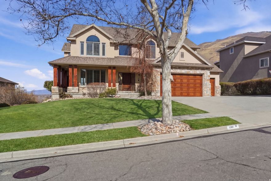 Stunning Draper two-story with a fully finished walk-out basement, offering nearly 5000 sq. ft. of beautifully designed living space in a highly sought-after neighborhood.  The upper level features four spacious bedrooms and two remodeled bathrooms, creating a comfortable and updated retreat. The main floor offers exceptional living and entertaining space, including formal living and formal dining rooms, a generous family room, and a private study-perfect for working from home.  Step outside the family room to a large covered back deck designed for year-round entertaining while taking in breathtaking mountain sunrises, vibrant sunsets, and sweeping valley views.  The fully finished walk-out basement adds incredible flexibility with two additional bedrooms, a full bath, family room, ample storage, plus its own kitchen and laundry area-ideal for multi-generational living, guests, or potential rental opportunities.  Enjoy the best of both worlds-trails right outside your back door, perfect for hiking, biking, and outdoor adventure, plus quick highway access for an easy commute. Shopping, dining, and everyday conveniences are just minutes away.  This home truly captures the best of Draper living-space, versatility, and unforgettable scenery.    Square footage figures are provided as a courtesy estimate only and were obtained from appraisal.  Buyer is advised to obtain an independent measurement.