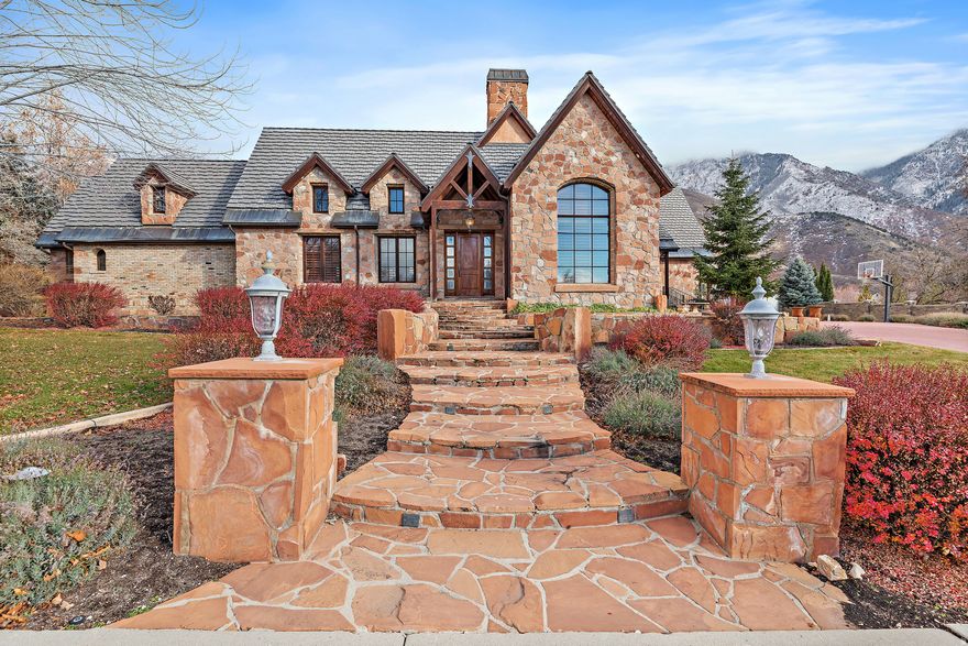 Timeless European luxury residence where architecture, craftsmanship, and setting come together in exceptional harmony. Resting on a pristine acre backing Lambert Park, this property offers unmatched privacy, scenery, and space. Every detail speaks to quality: 12" thick exterior walls, exquisite wood trim, custom finishes, and HIGH-END DESIGN at every turn.  The main floor master suite creates a retreat of its own, while the soaring vaulted family room and expansive entertaining areas invite memorable gatherings. The chef's kitchen elevates daily living with a Viking range, Sub-Zero refrigeration, and elegant custom cabinetry. Oversized windows capture dramatic mountain views and blur the line between impressive indoor and outdoor living.  With a NEW tile roof, HORSE PROPERTY designation, and a quiet cul-de-sac location, this home is both timeless and rare... purposefully built for those who appreciate craftsmanship over short-term trends and quality over quantity.