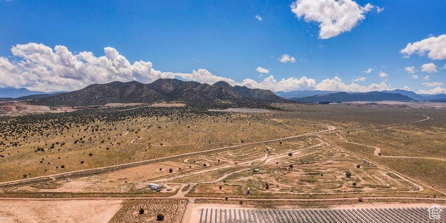Rare opportunity to secure 51.46 acres of prime commercial land with direct highway access and 2 acre-feet of water rights. The property features a full motocross track, multiple usable structures, and 8 RV hookups already in place. Bordering a railroad, it offers outstanding versatility for recreation, events, or future commercial development. A unique property with endless potential! Buyer/buyer agent is responsible for verifying all information.