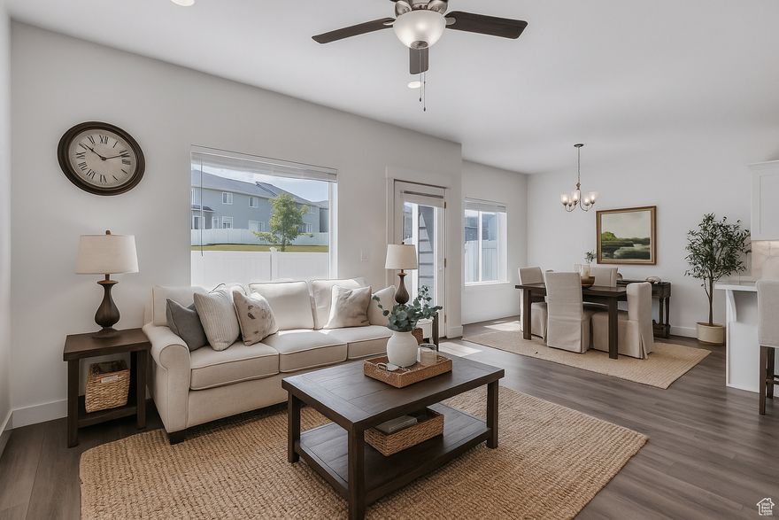 This beautifully maintained end-unit townhome features 5 bedrooms, 2 full bathrooms, and 2 half bathrooms, offering spacious and flexible living. The fully finished basement provides additional room for a home office, media space, or entertaining area. Located in a highly desirable community, residents enjoy access to outstanding amenities including parks, playgrounds, a clubhouse, fitness center, and swimming pool. The home also includes an EV charger setup, perfect for electric vehicle owners. As an end-unit, the property offers increased natural light and added privacy, all while being conveniently located just minutes from major retailers such as Walmart, Costco, and Smith's, as well as a variety of shopping and dining options. A rare combination of space, comfort, and location. Owner/Agent.  Square footage figures are provided as a courtesy estimate only and were obtained from county records. Buyer to verify all.