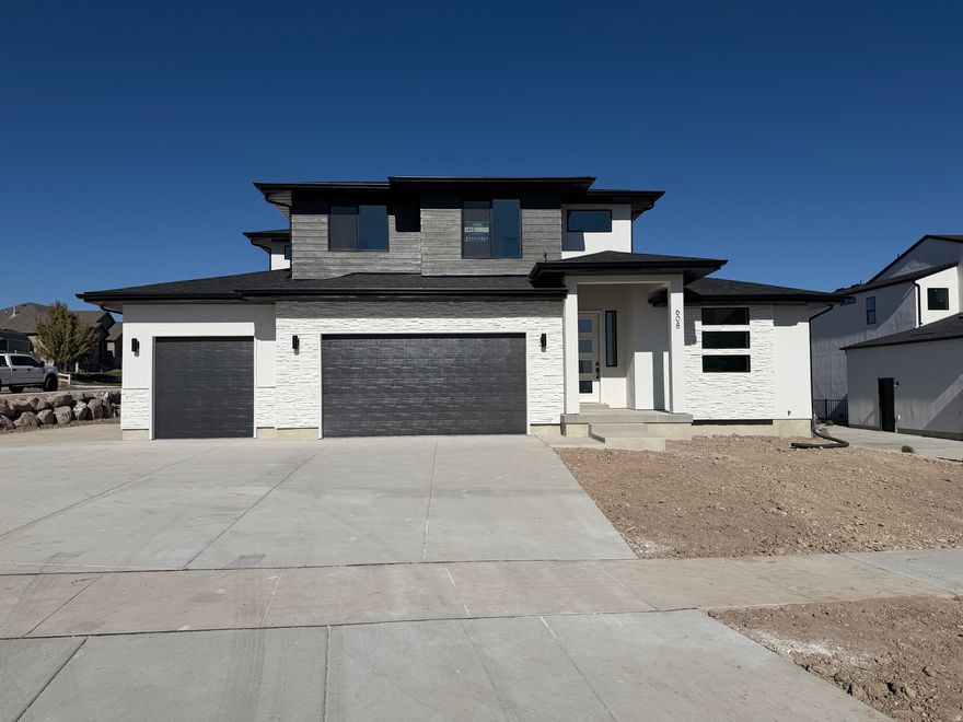 Come visit this home located in the beautiful Dignity Subdivision in northern Saratoga Springs. This cul-de-sac community provides 10 new home sites near Utah Lake with views of the mountains. This home is fully selected and at frame finish on 1/3 acre south facing lot. With a fabulous incentive! $20,000 when using listed lender, or $18,000 when using outside lender, funds can be used towards closing costs and interest rate buy-downs. This beautifully equipped and fully upgraded Maple plan offers exceptional living space and modern design. The main floor features a spacious primary suite with a large, luxurious bathroom. The double-height great room, complete with a cozy fireplace, creates a stunning focal point for the home. The basement, with its private entrance, 9' ceilings, with a finished 2 bedroom ADU and RV/Tenant parking area. Contact me today for more details.