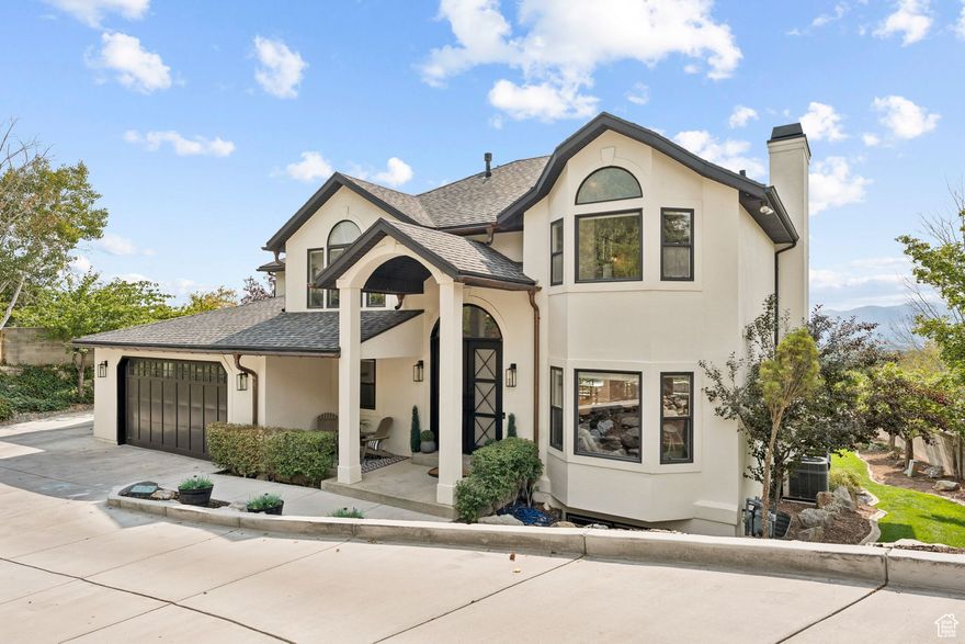 WOW!  What a find!  Santa won't be landing on this nearly new heated driveway!  Do nothing, the snow and ice just melts! Home is nestled on Salt Lake City's east bench, this fully remodeled home offers elevated luxury living with stunning 180-degree valley, mountain and city views. Light, bright and beautiful this two-story home sits on a flat 0.45-acre lot backing the Bonneville Trail also providing unbeatable access to hiking, biking, nature and stunning sunsets. Add to it the beautiful curb appeal, this home really pops with the copper gutters, Ironworks front door and a tree filled private lot. Inside be wowed by the vaulted ceilings and the high end finishes.  Enjoy this fully remodeled home including beautiful hardwood floors, a chef's kitchen with top-of-the-line appliances, large windows with views for miles.  Open and comfortable great room with views for miles.  Gas fireplace makes for warmth and ambiance. Covered deck is great for BBQ'ing and relaxing. Large primary suit with private balcony and a spa-inspired primary bathroom with a steam shower and multiple shower heads.  Large walk out basement with wet bar, family room and storage closets. Entertain year-round on the covered deck, unwind in the hot tub and watch your favorite team on the outdoor TV, or watch the sunset over the valley. The 4-car garage with level 2 electric charger and the heated driveway ensure comfort and convenience. With no backyard neighbors, a built-in trampoline, playground and expansive flat grassy yard, this home is perfect for those seeking space, luxury, and lifestyle.  Don't wait, come and see!