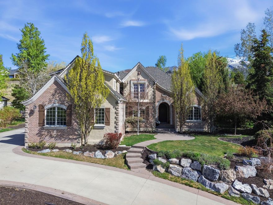 Welcome to this stunning Alpine home, where breathtaking mountain and valley views create an unforgettable backdrop for everyday living. Perfectly situated in a highly desirable neighborhood, this property offers both beauty and functionality in every detail. The home features 7 spacious bedrooms and 4 well-appointed bathrooms, providing plenty of room for family and guests. Beautiful gourmet kitchen. A full basement apartment adds incredible flexibility-ideal for extended living, rental income, or a private guest retreat. The bonus room over the garage offers even more space for a home office, playroom, or media room. Step outside to enjoy the professionally landscaped yard, designed for both relaxation and entertaining, all while taking in the surrounding natural beauty. With its charming appeal, versatile layout, and unbeatable views, this Alpine home is a rare opportunity to enjoy comfort, elegance, and scenic living all in one.  Square footage figures are provided as a courtesy estimate only and were obtained from an apprisial.  Buyer is advised to obtain an independent measurement.