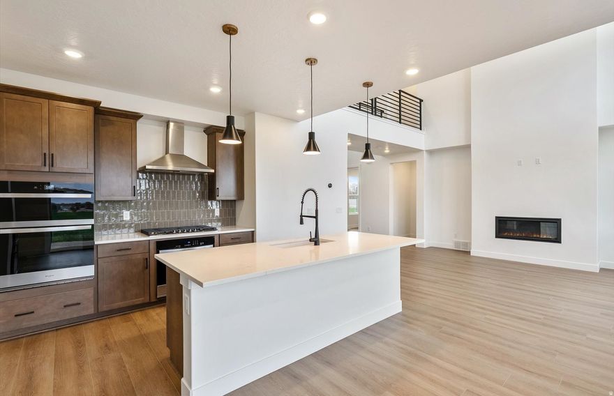 READY MOVE-IN HOME located in a quiet cul-de-sac. Beautiful new 2 story, 4-bedroom, 3 baths on 0.34-acre lot. This thoughtfully designed home features a 3-car garage, tall ceilings in the great room that create an open to above atmosphere. Upgraded cabinets with quartz countertops throughout. The modern kitchen is perfect for anyone who loves to cook; it is equipped with a stainless-steel gas top range, two ovens, dishwasher and microwave oven. This home has an open floor plan perfect for family gatherings or entertaining with large windows to see the mountain views. Mud room with built in bench. Large spacious laundry room next to bedrooms. The owner's suite offers a beautiful walk-in shower, double sink vanity, and a spacious walk-in closet. Enjoy the open floorplan with a large yard and views of the mountains everywhere you look in the neighborhood.