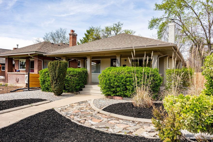 Set on a corner lot along the tree-lined streets of Salt Lake City's vibrant Sugar House neighborhood, this classic bungalow offers a noteworthy blend of historic charm, thoughtful updates and exceptional walkability. Ideally located just minutes from Sugar House Park, downtown Salt Lake City and the University of Utah, this property offers a welcoming residential setting and convenient access to the city's top amenities and offerings. Carefully renovated with an eye toward preserving its original character, this home seamlessly balances timeless architectural details with modern comforts. Natural light fills inviting living spaces; the front sitting and dining rooms flow effortlessly into an open concept gourmet kitchen designed for both everyday living and gathering with extended friends and family. The custom kitchen features shaker style cabinetry, abundant storage, granite countertops and bar seating for four. A gas cooktop and vented hood provide both functionality and style, while nearby built-ins and a dedicated laundry area add convenience to this home's thoughtful layout. The main level offers three bedrooms, including a spacious primary suite complete with a walk in closet, custom granite topped vanity and Euro glass shower. Two additional bedrooms provide generous closet space and flexibility for guests, visiting family or a home office. A secondary bathroom features a soaking tub and shower combination with granite topped vanity. The lower level offers substantial storage space, adding practical versatility to the home. Outdoors, a private backyard extends the living experience with a deck that's ideal for entertaining, a charming patio with hot tub for relaxing evenings and ample lawn space for gatherings, barbecues and enjoying Utah's beautiful seasons. This beautifully updated Sugar House bungalow presents a wonderful opportunity to enjoy one of Salt Lake City's most desirable and established neighborhoods.