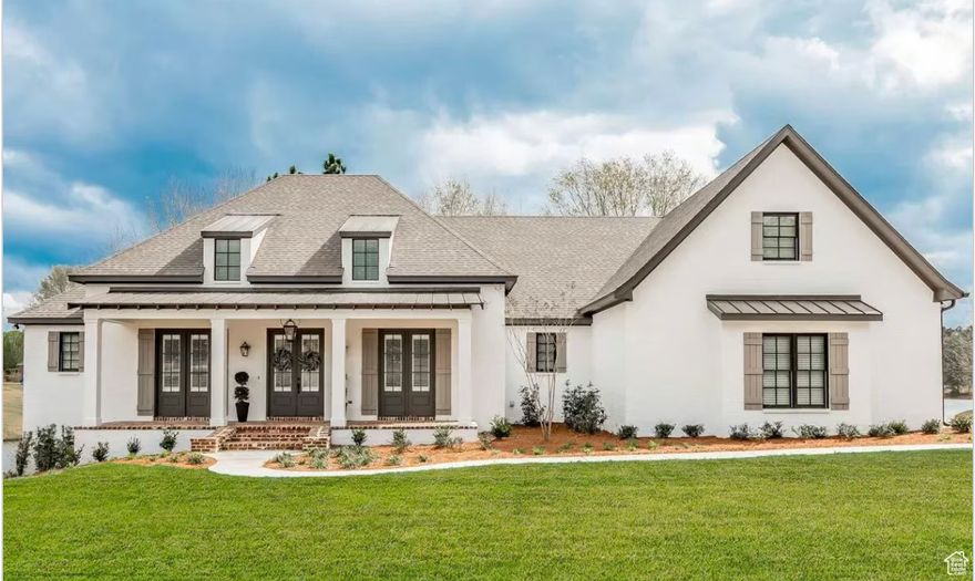 TO BE BUILT! Charming Mountain Retreat with Thoughtful Modern Design combines timeless curb appeal with practical elegance. Two classic dormers crown a welcoming front porch blending comfort, functionality, & style. Enter to find a quiet office just off the foyer, complete with French doors and private access to the front porch-ideal for remote work or peaceful reading. Open-concept living space, where the great room, kitchen, and dining area flow seamlessly together under soaring 12-foot ceilings (with an optional vaulted ceiling reaching up to 16'6" for added drama). Chef's kitchen features a generous island with seating, & oversized walk-in pantry.  Entertain on the cozy  porch, complete with a fireplace to keep things warm.  The luxurious primary suite includes dual bathrooms, each with its own vanity and private space, connected by a spa-like shower with dual shower heads. Two additional bedrooms are located on the opposite side of the home, offering privacy for family or guests. Spacious mudroom featuring built-in lockers, located just off the garage and next to a well-equipped laundry room with utility sink. A large bonus space above the garage offers endless possibilities-media room, playroom, guest suite, or gym.