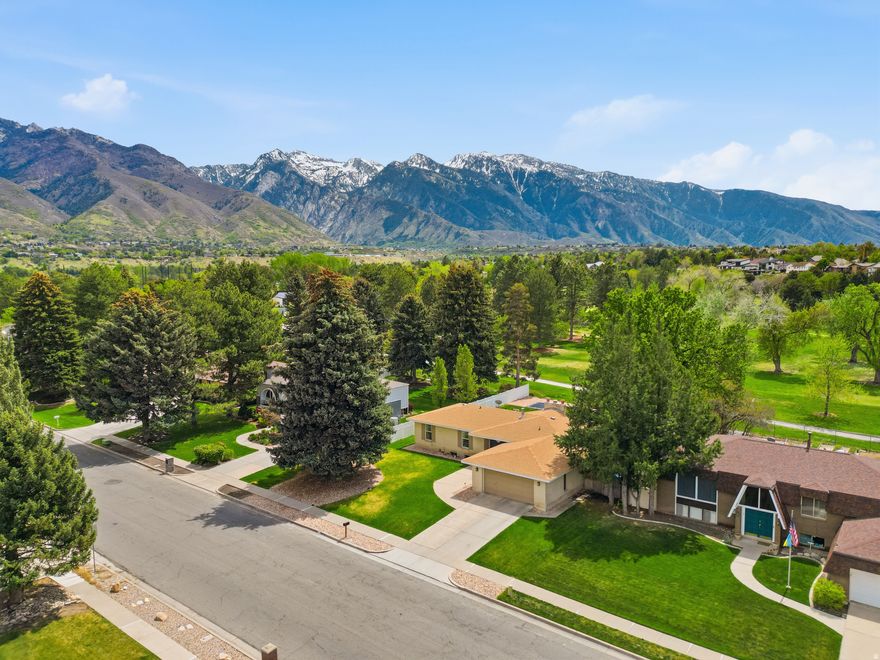 ** OPEN HOUSE, Sat 4/25 11-2:00 ** The one you've been waiting for! Perfectly positioned along the prestigious Willow Creek Golf Course, this home offers unobstructed fairway views with the stunning Wasatch Mountains as your backdrop. This beautifully remodeled rambler features an open-concept floor plan with 6 spacious bedrooms and 4 bathrooms, thoughtfully designed for both comfort and functionality. Multiple gathering spaces, including two family rooms, two kitchens, and cozy wood-burning fireplaces-make it ideal for entertaining or multi-generational living. The main-level kitchen is a true highlight, showcasing quartz countertops, a double oven, countertop range, and abundant cabinetry. Ideally located just minutes from Cottonwood Canyons, world-class ski resorts, shopping, dining, scenic trails, and top-rated schools, this home offers an exceptional blend of lifestyle and convenience. Buyer to verify all information.