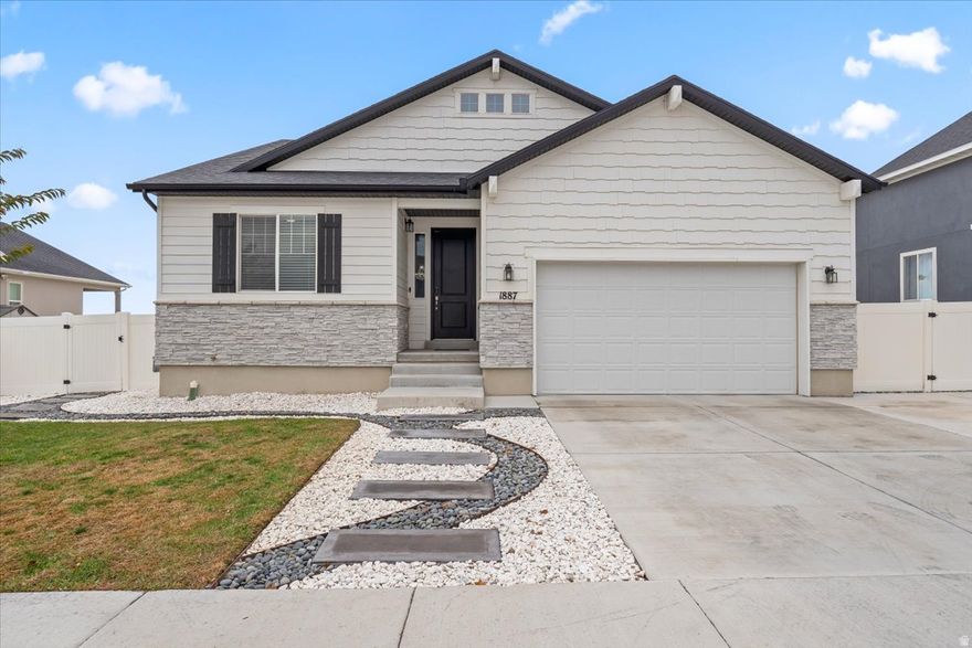 PRICE REDUCED! Walk in with instant equity! Exceptional value and single level living with over 3,000 sq ft, rare in this area at this price! Why wait for new construction when you have this pristine, move in ready & meticulously cared-for rambler at a better price. Loaded with upgrades throughout, including vaulted ceilings, 8 foot doors, wainscoting, LVP flooring, and a gourmet kitchen with granite countertops, soft close cabinetry, gas appliances, and filtered tap water. Main level primary suite with soaking tub, separate shower, dual sinks, walk in closet, and bidet ready plumbing. Thefully finished basementfeatures 9 ft ceilings, an optional 6th bedroom, and acomplete home theater wiring setupincluding projector and 7.2.4 surround sound.  Private backyard retreat backs up to a protected conservation land that should remain untouched, offering peace, privacy, andunobstructed Oquirrh Mountain views - along with beautiful landscaping with full vinyl fencing and a sleek stamped concrete patio, ideal for entertaining under the stars. RV parking and an oversized driveway accommodate every adventure. Smart home features, water softener, and efficient newer systems for low maintenance living. This home offers space, comfort, and OUTSTANDING value - Located just 20 minutes from Salt Lake City without the Salt Lake county prices!! Come experience the rare combination of size, condition, upgrades, and price that makes this home stand out in today's market. Buyer to verify all information and square footage. Square footage figures are provided as a courtesy estimate only; buyer is advised to obtain an independent measurement. This home is covered by SilverBack Home Warranty and the policy will be transferred to the buyer at closing.