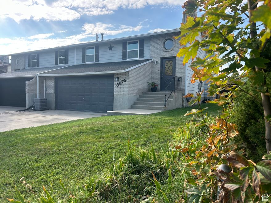 Check out these Modern Updates! This freshly painted 3-bedroom, 2-bath home features brand new flooring, a cozy fireplace, and a wood-burning stove. Enjoy outdoor living on the walk-out deck and the convenience of a spacious 2-car garage. Located on a quiet, family-friendly street-perfect for creating new memories. Don't miss this inviting and comfortable home! Just added new windows, air conditioning unit, and garage opener.