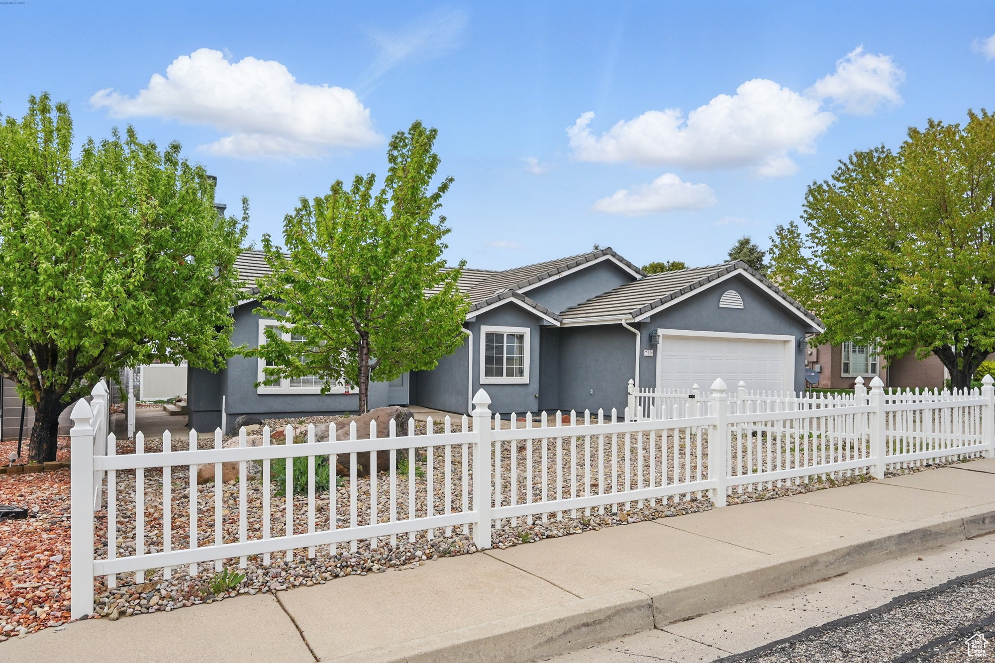 This is the home you've been looking for! So much charm, great neighborhood, great location within the city in the quiet southeast side, close to walking & biking trails and easy access to shops and restaurants! 3 beds and 2 baths plus great details like a gas fireplace, double vanity and walk-in shower in the master, low- maintenance landscaping, fencing, concrete tile roof and finally - a white picket fence in front! The only other thing better than that is NO HOA! Immaculate with a long history of good maintenance. You must see this home for yourself! This home is great for growing families, those downsizing, or investors/nightly rentals.