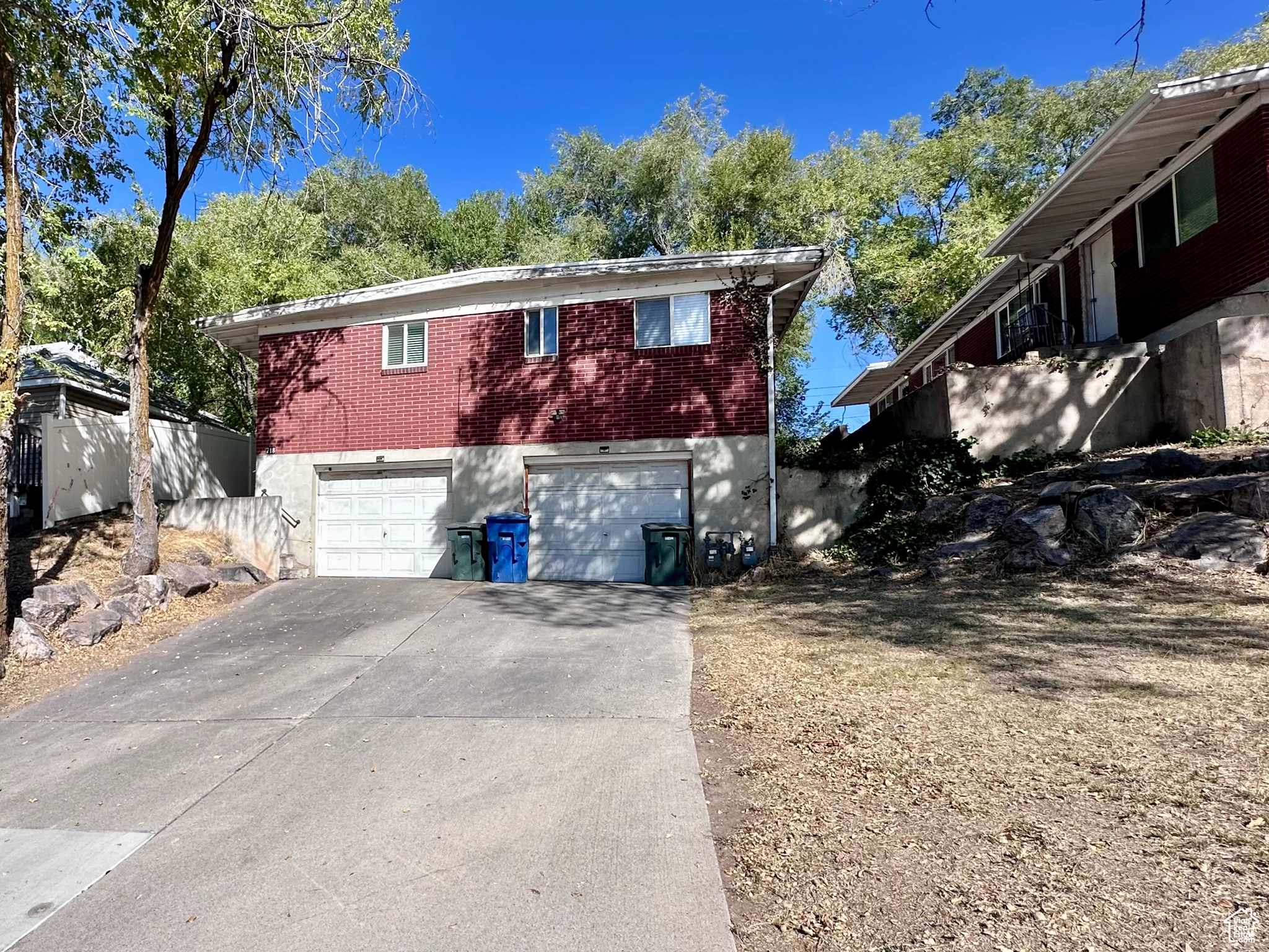 INVESTORS (1031) LOOK AT 2 adjoining duplexes near Weber State University. Each unit has 2-beds 1-bath with a dedicated garage. Situated near campus, shopping district, and public transit, this property is perfectly positioned for consistent occupancy and long-term value. Listing property facts and list price are specific to this parcel. Buyers are encouraged to purchase both properties together. Adjoining parcel MLS# 2098919. No seller financing!
