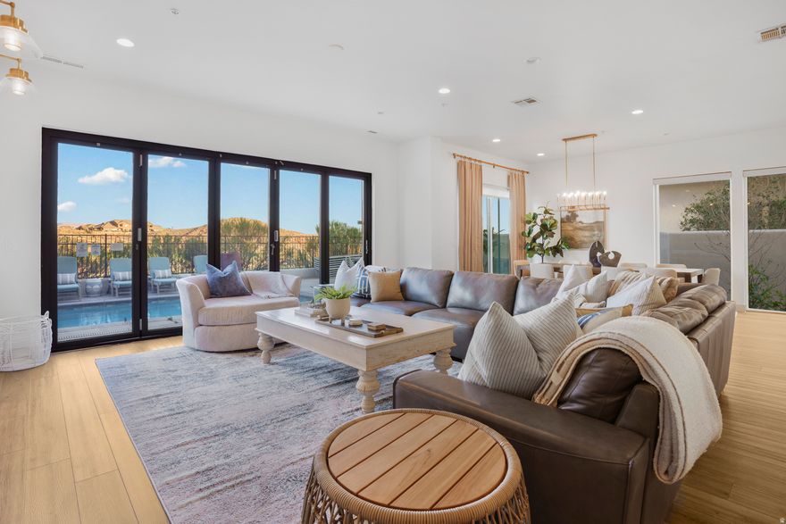 Renovation Just Completed! This property has undergone a complete transformation, featuring all new paint, new flooring throughout, and a full designer makeover by Harmony Young Design of Salt Lake City with over $100k in new furnishing inside and out. Every detail has been thoughtfully refreshed, creating a bright, modern interior that feels entirely new. NIGHTLY RENTAL APPROVED. Ideally positioned along the scenic Coral Canyon Golf Course, this premium golf-side location offers beautiful views and exceptional convenience just minutes from St. George and Southern Utah's outdoor recreation. Inside, the home features quartz countertops, high-end stainless steel appliances, laminate flooring, spacious walk-in closets, and a layout designed for comfort and functionality. The highlight is the rooftop lounge with fireplace, creating the perfect space to relax, entertain, and take in the surrounding views. The owner also owns the adjacent unit (#2272), which has undergone the same designer renovation and is also available for purchase, presenting a rare opportunity for investors or buyers seeking multiple nightly-rental properties side-by-side. With a complete designer renovation and nightly rental approval in one of Southern Utah's most desirable golf communities, this unit truly stands apart. Come see it for yourself.