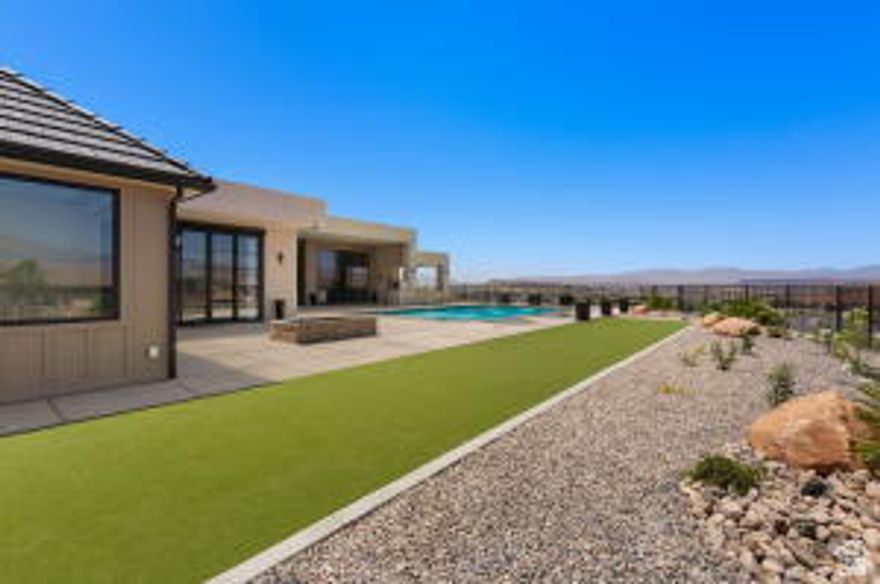 Exquisite new single-level residence on a private 1.7-acre parcel--no HOA--offering an elevated, elegant lifestyle for discerning buyers. Situated on a quiet cul-de-sac with sweeping views of Pine Mountain and city lights, this beautifully detailed home features expansive, warm-toned interiors, grand-scale rooms, and thoughtful entertaining spaces throughout. Please be sure to enjoy the Matterport Tour under the 'Photos' icon. Automotive and recreational amenities are unmatched: a 20' x 55' RV garage with a 14' x 14' door, dedicated boat garage, and nine-car garage capacity with oversized doors and Faraday-shielded workspace; two 240V EV plug-ins. Resort-style grounds include a 25' x 45' heated pool with hot tub and fountains, outdoor kitchen, pickleball court, two fire pits, and an inground trampoline. Interior highlights showcase a chef's dream kitchen, large pantry with adjoining butler's kitchen, home gym, luxurious theater with extensive DVD storage, bunk room, and thoughtfully designed comforts. Every bedroom is a private suite, including a luxurious primary suite which delivers his-and-hers spacious closets, a fireplace and serene sightlines to the views--perfect for buyers seeking elevated, refined living in an unmatched, showpiece property. This truly is a lovely, one of a kind estate. Any photos that appear with furniture are digitally staged. Please be sure to enjoy the Matterport Tour located in the 'Photos' icon.