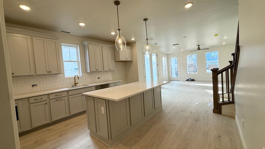 ASK ABOUT OUR CURRENT INCENTIVE! ONE OF THE LAST CHANCES TO OWN IN LOWER DAYBREAK. A new upscale home in the heart of Daybreak by downtown Daybreak, just steps from Utah's first sports and entertainment district, parks, TRAX, Oquirrh Lake, and Soda Row. This desirable home features: corner homesite, long driveway, front yard and side yard (could add 6' privacy fence to side yard and have about 12' x 32' of enclosed yard), tall ceilings throughout, mountain views, 3rd floor gameroom/bonus room, office/retreat space, EV-ready outlet, and professionally designed finishes. Too many features to list! Estimated completion February 2026. Call today to schedule your private showing. (Finishes pictures shown is of the "virtual model home" of this floorplan, not of actual home. Design board of actual finish shown in pictures list)