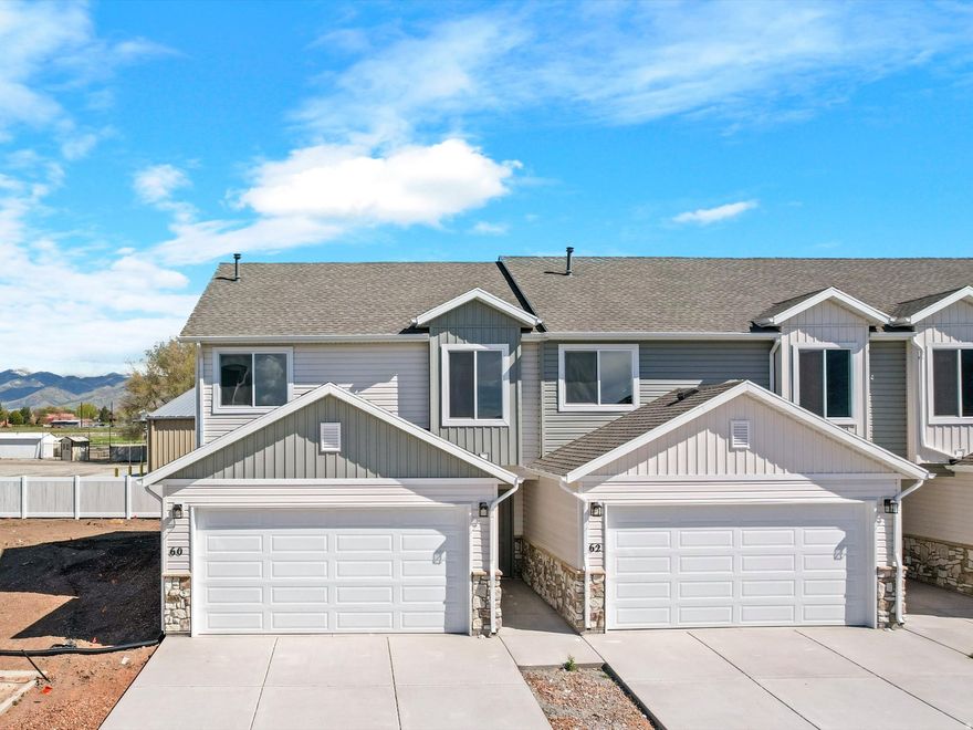 Preferred Lender Incentive Available: Buyer may receive up to $10,000 toward closing costs, prepaids, or rate buydown when financing with seller's preferred lender. Contact listing agent or lender for full details and qualifications. 3 Bedrooms | 3 Bathrooms | Attached Garage Experience the luxury of being the very first to live in this stunning, new construction townhome in the heart of Malad City. Currently under construction with a projected completion date of late April, this home offers the perfect opportunity to secure a modern residence just in time for the spring season. Modern Interior & High-End Finishes Gourmet Kitchen: The heart of the home features sleek quartz countertops, custom cabinetry, and a layout designed for both functionality and style. Spacious Living: With 3 well-appointed bedrooms and 3 bathrooms, the floor plan maximizes space and natural light, providing a fresh, contemporary feel. New Everything: From the energy-efficient HVAC system to the brand-new appliances and flooring, enjoy the peace of mind that comes with a full builder warranty and zero "fixer-upper" projects. Exterior & Location Attached Garage: Stay out of the Idaho elements with a private, attached garage that offers extra room for storage or recreational gear. Prime Malad Location: Situated with easy access to I-15, you are perfectly positioned for a quick commute to Logan or Pocatello, while being just minutes away from the outdoor recreation Malad is known for. Low Maintenance: The townhome lifestyle offers the benefit of a newer property with less exterior upkeep, allowing you more time to enjoy the surrounding mountain views and local amenities. Don't wait-new construction in Malad City moves quickly. Contact us today for a construction progress tour and to see the finish samples! Square footage figures are provided as a courtesy estimate only and were obtained from builder records.  Buyer is advised to obtain an independent measurement.