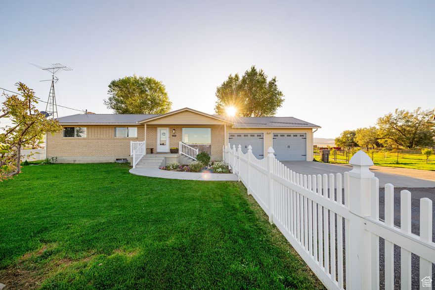 Come enjoy this charming rambler in beautiful Stone, Idaho! This cozy home has 5 bedrooms, 2 bathrooms and sits on just under an acre of fenced land - complete with an automatic sprinkler system, lots of grass, mature trees, an abundant garden with raised beds, greenhouse, chicken run, duck pond, and a small orchard! Bring your animals - perfect for horses and livestock! Various updates throughout the main floor include newer paint and granite countertops in the kitchen. The basement has potential for a 3rd bathroom with a working toilet. You'll appreciate the low cost of maintenance with the metal roof and brick exterior as well as large 2-car garage, RV parking, your own private well, and a large propane tank that goes with the new owner. Tucked into a peaceful farming community with beautiful mountain views - just a few minutes from Snowville, the UT/ID border, Stone Elementary, and Stone Reservoir with plenty of opportunities for camping, fishing, hunting, and recreation. Incredible value! *Ask about the assumable loan with a 2.99% interest rate!* Come see this home today!