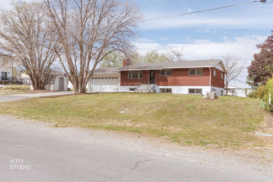 Must See! This Santaquin rambler sits on a huge .47 acre lot and features a great income producing basement apartment (legal ADU!), animal rights and so much more! This property will be an incredible investment (producing 2750+ in monthly rent when fully rented) while being just 20 minutes from Provo and other work and shopping options. You'll also enjoy a huge oversized garage, covered patio space, large sunroom with storage and multiple sheds. Don't miss out, come see it today!