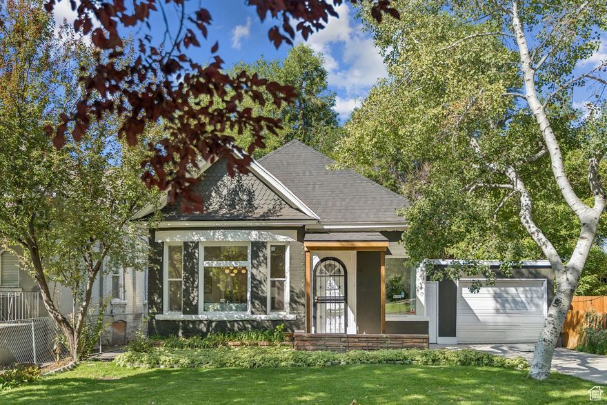 Situated right behind Trolley Square and just a couple of blocks from Liberty Park, this beautifully updated historic home blends timeless character with today's modern conveniences. Step inside to find soaring ceilings, brand-new flooring, and a stunning open-concept layout that feels both spacious and inviting.  The heart of the home is the modern kitchen, featuring sleek new cabinets, quartz countertops, and stainless steel appliances-perfect for cooking and entertaining. With 4 bedrooms and 2 bathrooms, there's plenty of space for family, guests, or a home office.  This property is also one of the rare finds in the neighborhood with both a garage and off-street parking. Outside, enjoy a fully fenced backyard shaded by mature trees, a covered patio for gatherings, and peace of mind with a brand-new roof and updated lighting throughout.  Unbeatable location, historic charm, and modern updates-this home truly has it all!  Square footage figures are provided as a courtesy estimate only and were obtained from County Records.  Buyer is advised to obtain an independent measurement.