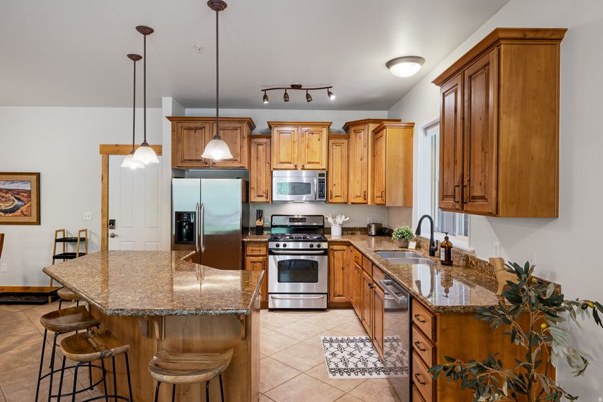 Beautifully updated 3 bed, 2 bath condo in The Lodges at Bear Hollow! This rare corner unit offers private and serene views of the mountains, aspen trees, and trails from the balcony and bedrooms! Inside you'll find thoughtful new upgrades throughout including: Fresh paint, carpet, washer and dryer, dishwasher, Nest thermostat, A/C unit, water softener, and updated plumbing. The kitchen features granite countertops, rich wood cabinetry, and beautiful wood shutters that create a warm and polished feel. The condo is tastefully furnished with new dcor and is included for a true move-in-ready experience. Enjoy the convenience of a secure heated underground garage with elevator access and assigned parking. Plenty of storage both in the garage and off the balcony. Exceptional flexibility with both short and long term rentals permitted making it ideal as a primary residence, vacation getaway, or investment opportunity. Located just minutes from Utah Olympic Park, world class skiing, and perfectly positioned along the free bus route for easy access to all that Park City has to offer.