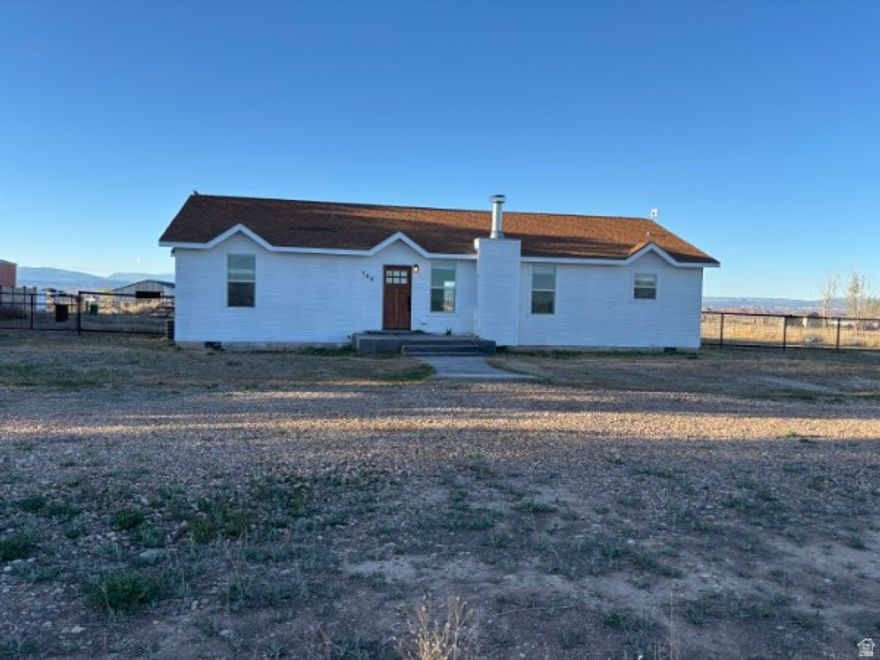 What a great home on 2 acres of horse property! Irrigation share comes with the sale. Incredible views.  Well maintained and clean 1789 square foot home. Wood burning stove for those winter nights. Very welcoming home and ready for you to move in and love life!
