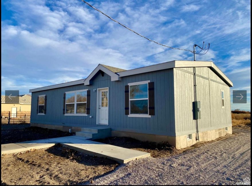 Like new, one-owner home on a huge lot.  Partially fenced for chickens.  Room for RV, lots of parking.  Located across from the Hinckley Rodeo Arena & Park. Open kitchen with bar to the living room.  Split bedrooms with 2 full baths.  Country living.