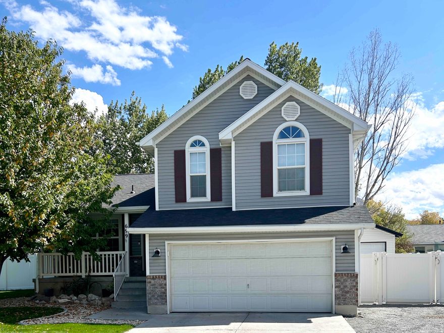 Multi-level home in Stansbury Park with bright open layout, spacious great room, large windows, and seamless indooroutdoor living. Fully fenced 0.25-acre lot offers RV parking, garden space, extra garage, and modern finishes throughout.    Square footage figures are provided as a courtesy estimate only and were obtained from tax records and prior listing.  Buyer is advised to obtain an independent measurement.