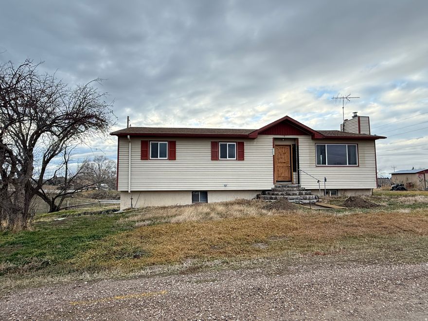 Home currently being renovated with new flooring, paint, front sidewalk, driveway and connection to city utilities. Owner may carry wtih adequated down payment. House and lot (62.5'x112') currently being divided from balance of the parcel.