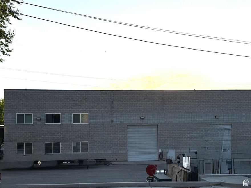 Two minutes to I-15.  Almost 4000 SF Warehouse space with 2100 SF Office space; AND 0.30 acre adjacent overflow parking with one 30' X 28' covered parking. The overflow parking is leased for 5 years at $500 a month. Warehouse space is at the center of the building with office space on the front/south portion of building.  Office space was built with in the last couple years. Gas powered back up generators recently installed. Warehouse is heated. Plenty of parking. Warehouse power: 200 Amp 277 Volt// 400 Volt 3-Phase Power.