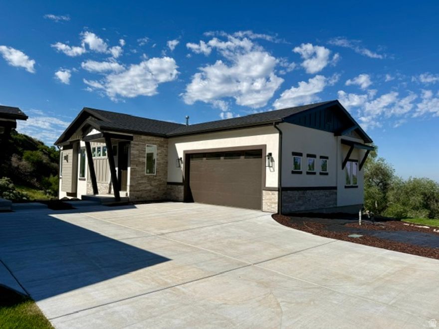Experience modern living at its finest on Ogden's East Bench. This brand-new home showcases high-end contemporary finishes, expansive city and mountain views, and direct access to miles of trails right out your front door with NO backyard neighbors. Thoughtfully designed and every upgrade imaginable with 10-foot basement ceilings, a finished 575 sq ft suspended garage bonus space,  wet bar, and a walk-out lower level that opens to those stunning views. Enjoy seamless indoor-outdoor living where every detail reflects elevated style. Estimated completion date: June 30