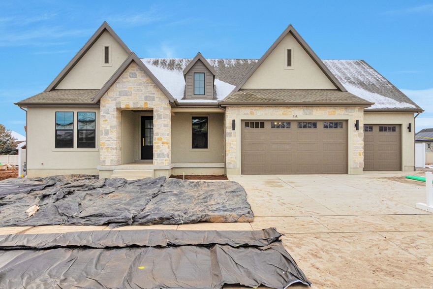 LOT#105. This East-facing "Treble XL" in Layton has tons of upgrades throughout this excellent and spacious floorplan! Price includes full landscaping and fully fenced backyard. Click on Quality LVP flooring, extra high ceilings and vaulted ceiling in the family room with stain grade beams. Kitchen has Zline appliances, including 48" dual fuel gas range, built-in side by side fridge & freezer. Walk-in butler's pantry. Huge dining nook. Large laundry room includes ample cabinetry, & countertop. Primary suite has a tray ceiling w/ crown and features a huge custom walk-in closet, and an elegant bathroom! You'll love entertaining in the finished basement featuring a beautiful wet bar. Lots of storage space throughout. 3rd stall of garage is 36' deep. Large covered deck to enjoy in the backyard. Great craftsmanship and interior design throughout.