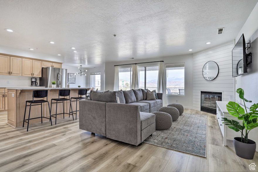 NEW PRICE! INSTANT EQUITY, BELOW APPRAISAL! NIGHTLY RENTALS ALLOWED! Discover the perfect investment opportunity or vacation getaway in this newly updated 3-bedroom condo located in the prestigious Las Palmas Resort in Green Valley, St. George. This unit stands out as one of the best in the development, boasting modern updates, breathtaking unobstructed views, and convenient main-level living. Situated on the rim of stunning red rock formations, the condo offers spectacular views of the canyon and valley. Las Palmas is a premier "all-inclusive family resort" featuring amenities that include indoor and outdoor pools, hot tubs, exercise facilities, basketball, tennis, and pickleball courts, volleyball, waterslide, and a splash pad. This prime location is steps away from some of St. George's top hiking and cycling trails and just minutes away from golf courses, boating, hiking, waterskiing, live theater, shopping, dining, and historic downtown. You'll also enjoy easy access to Tuacahn Amphitheatre, Snow Canyon State Park, and nearby National Parks. This condo is being sold FULLY furnished and turnkey-ready for nightly rentals. Don't miss this rare opportunity to own a piece of paradise in one of St. George's most sought-after communities. Square footage figures are provided as a courtesy estimate only and were obtained from county records. Buyer is advised to obtain an independent measurement.