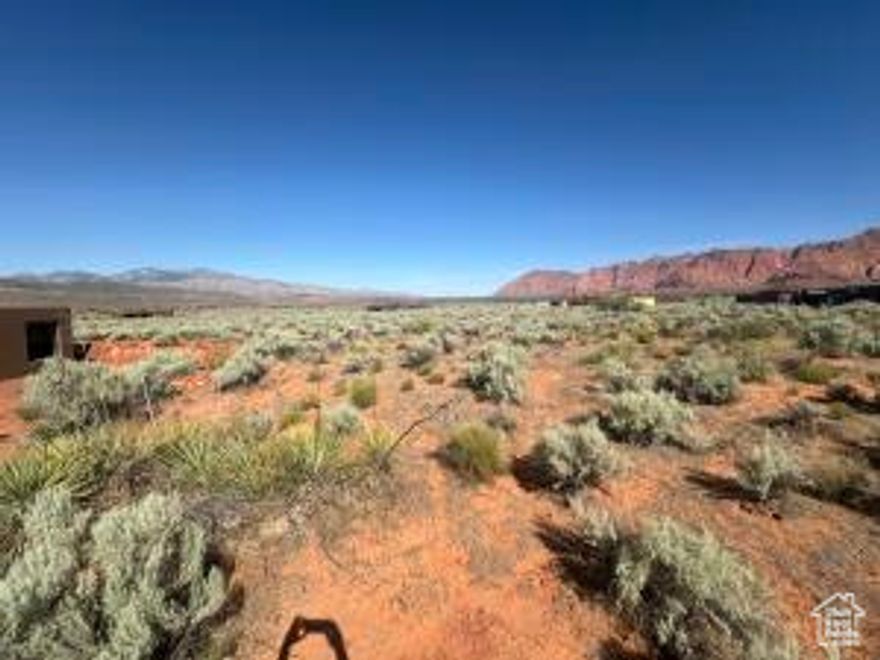 This .53 acre corner lot reflects what Kayenta is all about. Dramatic red mountain views to the north and panoramic vistas to the southwest where you can blend with the natural environment and enjoy the spectacular scenery that the Kayenta landscape has to offer. The Washington County Water Conservancy District Impact Fee has been paid on this lot saving you approximately $13,000 when permits are pulled.